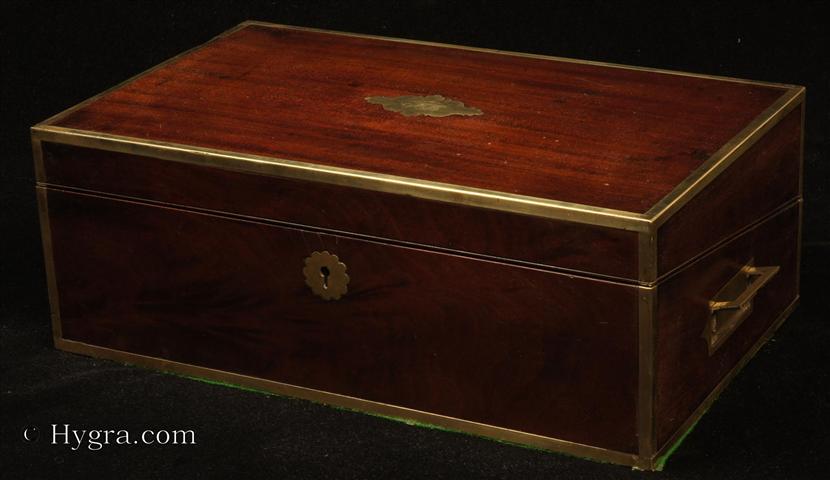 Regency brass edged mahogany writing box with  secret  drawers, by Thomas Lund of Cornhill, a replacement leather writing surface and compartments for pens and stationery. Circa 1820.  Enlarge Picture